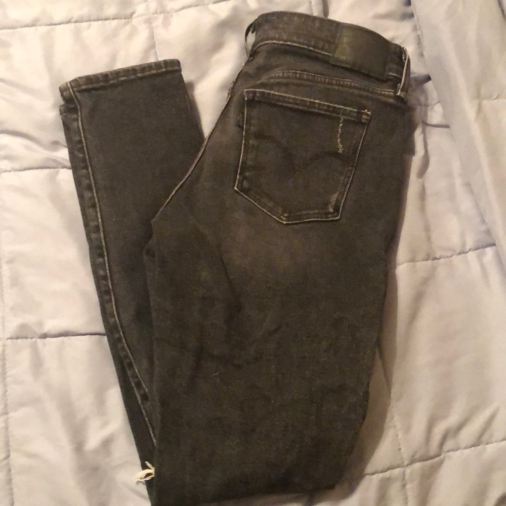 Faded black jeans with holes
